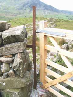 photo: gate with fish-belly rail gatepost