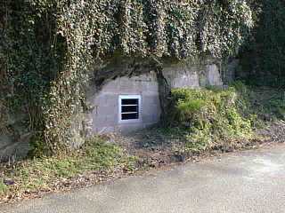 photo: walled-up adit entrance